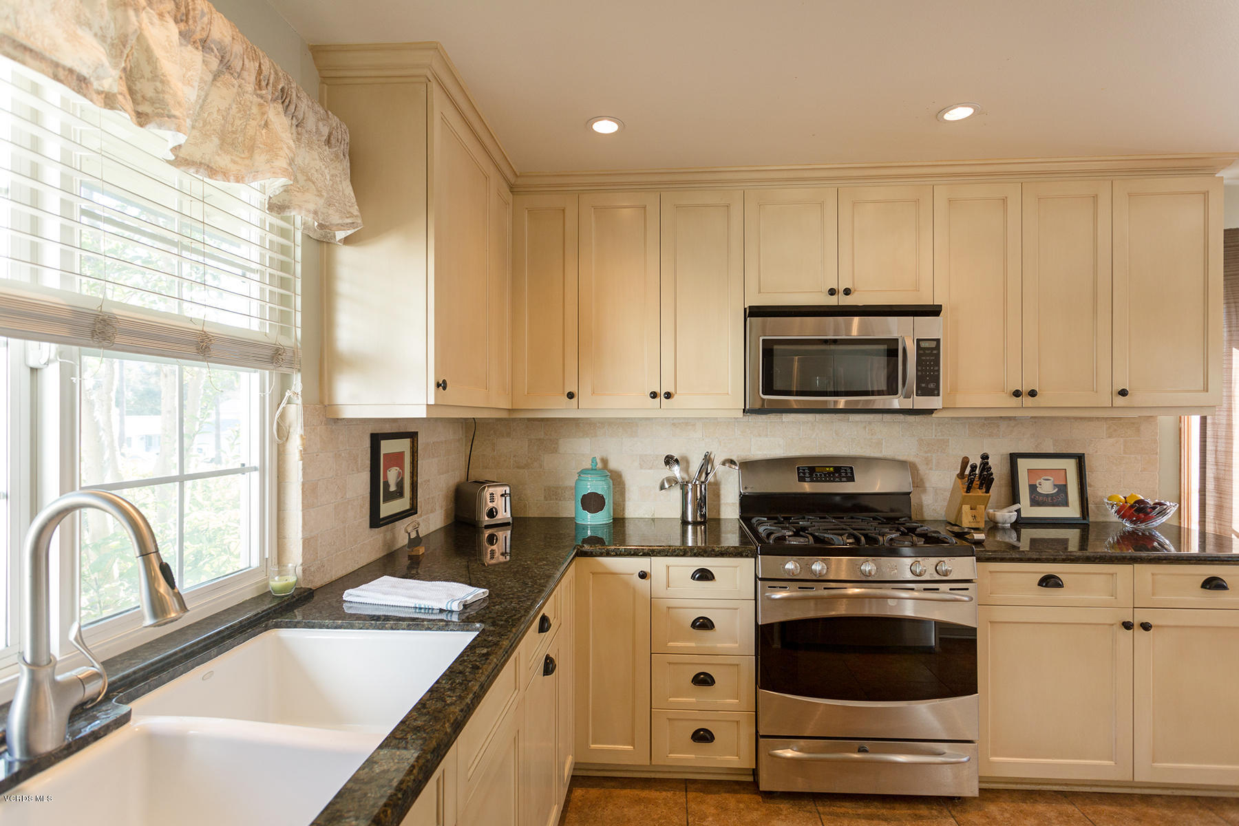 648 Appleton Road Simi Valley, CA 93065 - Photo 22 of 42 a kitchen with granite countertop white cabinets and stainless steel appliances