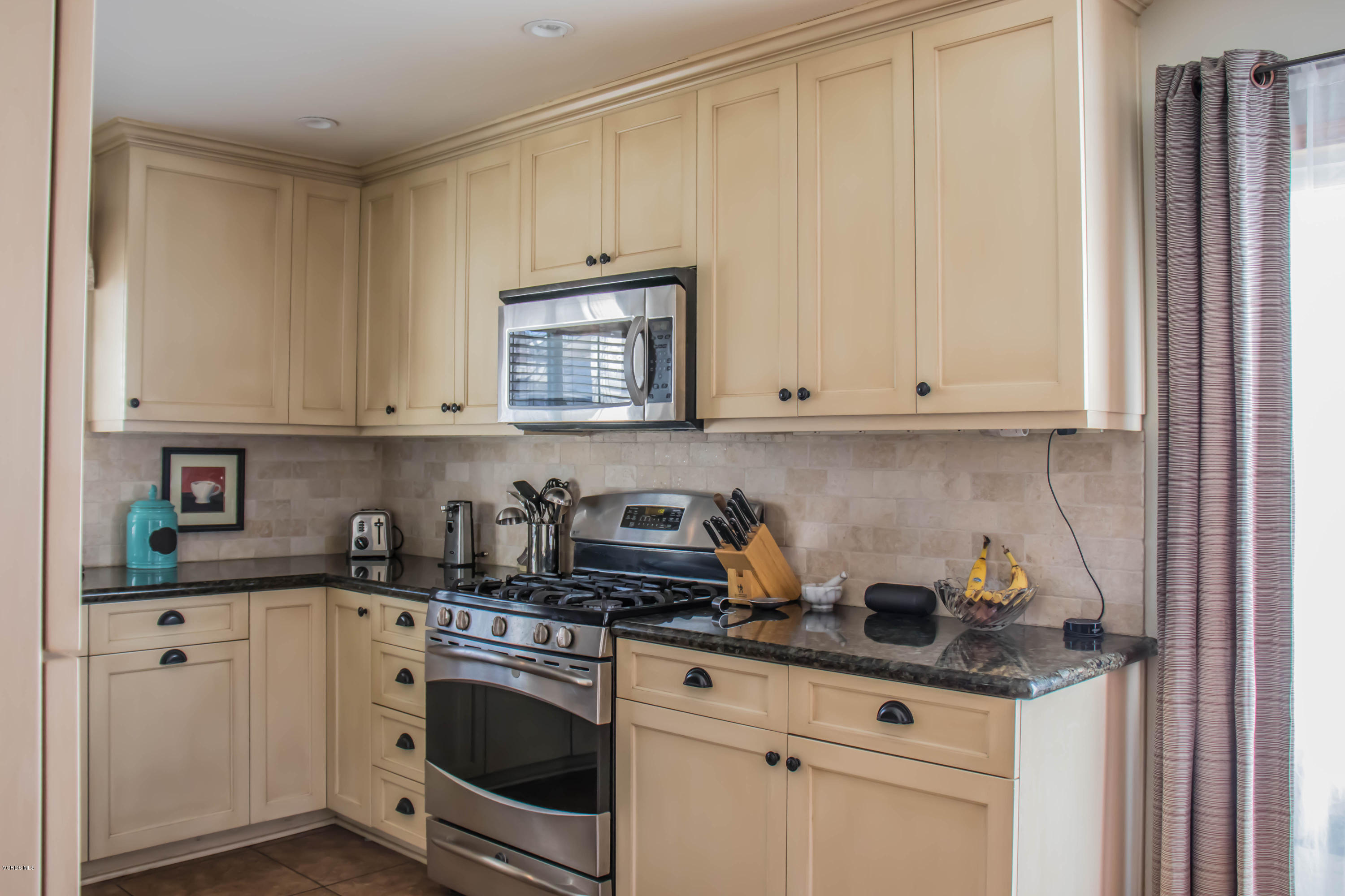 648 Appleton Road Simi Valley, CA 93065 - Photo 23 of 42 a kitchen with stainless steel appliances granite countertop a sink a stove and cabinets