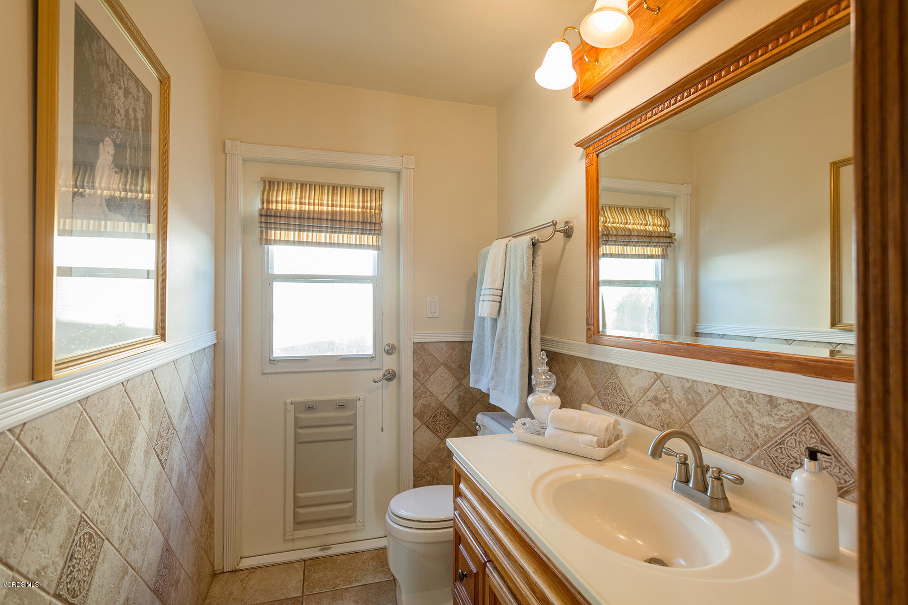 648 Appleton Road Simi Valley, CA 93065 - Photo 26 of 42 a bathroom with a sink a toilet and a mirror