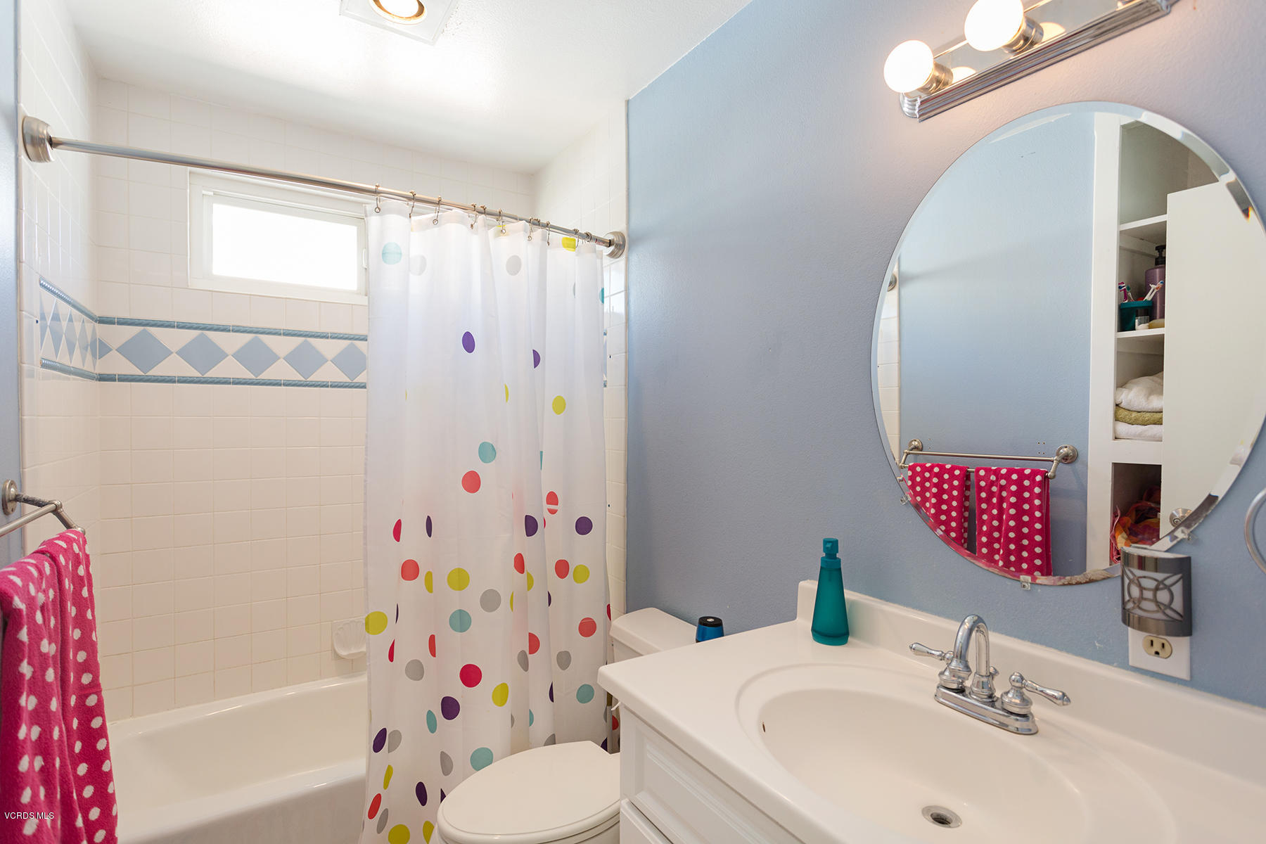 648 Appleton Road Simi Valley, CA 93065 - Photo 29 of 42 a bathroom with a sink and a mirror