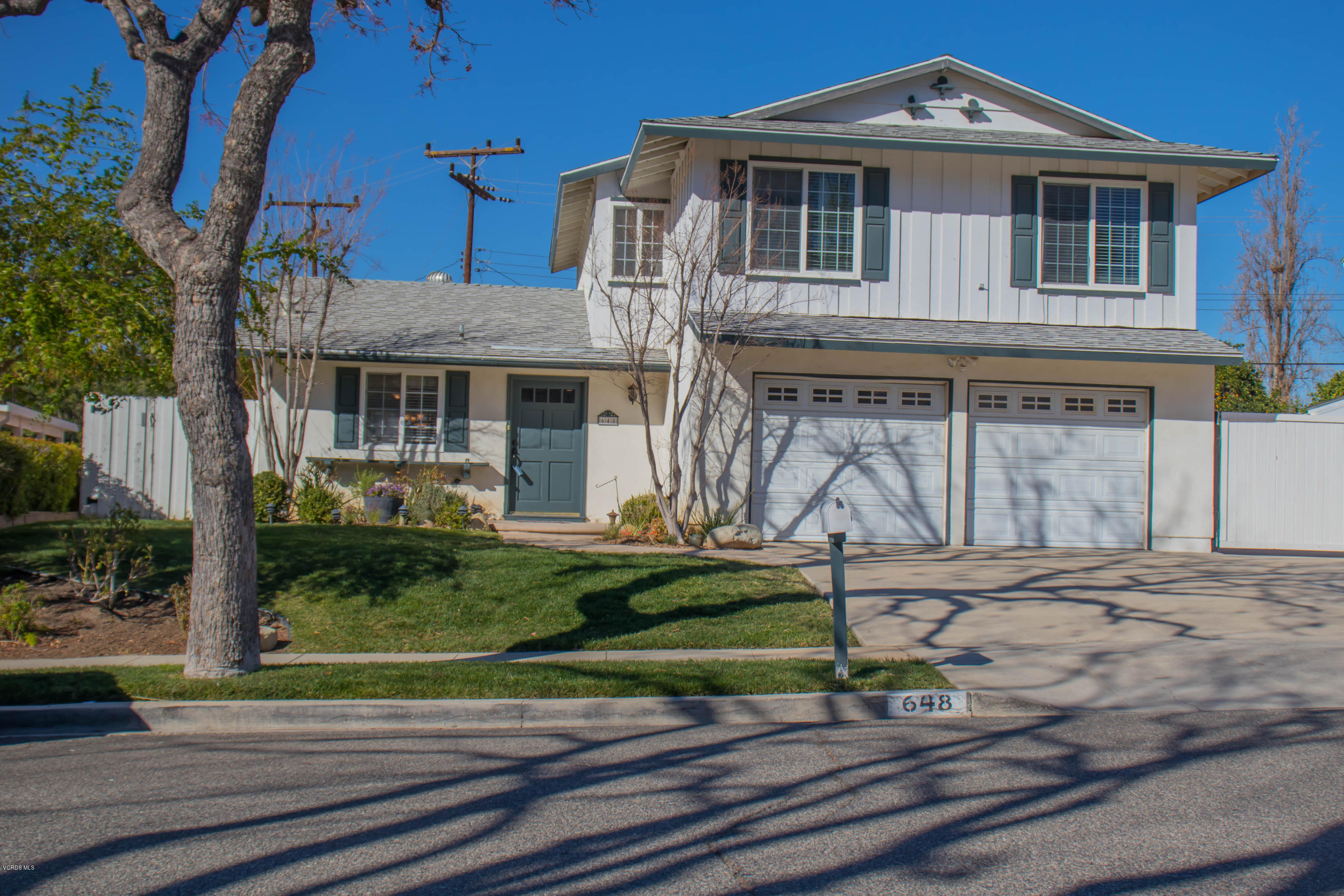 648 Appleton Road Simi Valley, CA 93065 - Photo 4 of 42 a front view of a house with garden