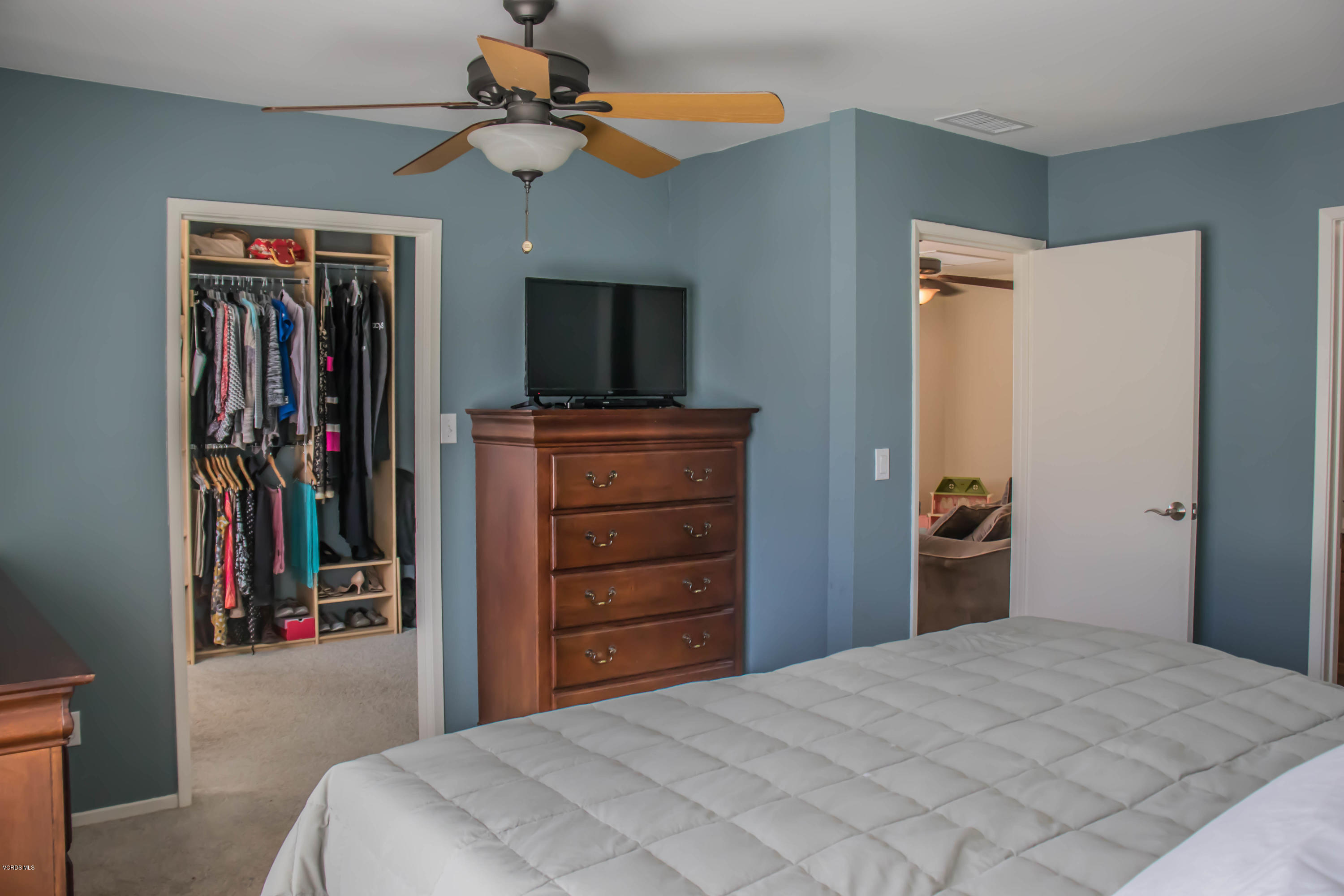 648 Appleton Road Simi Valley, CA 93065 - Photo 32 of 42 a bedroom with a bed and a flat tv screen on dresser