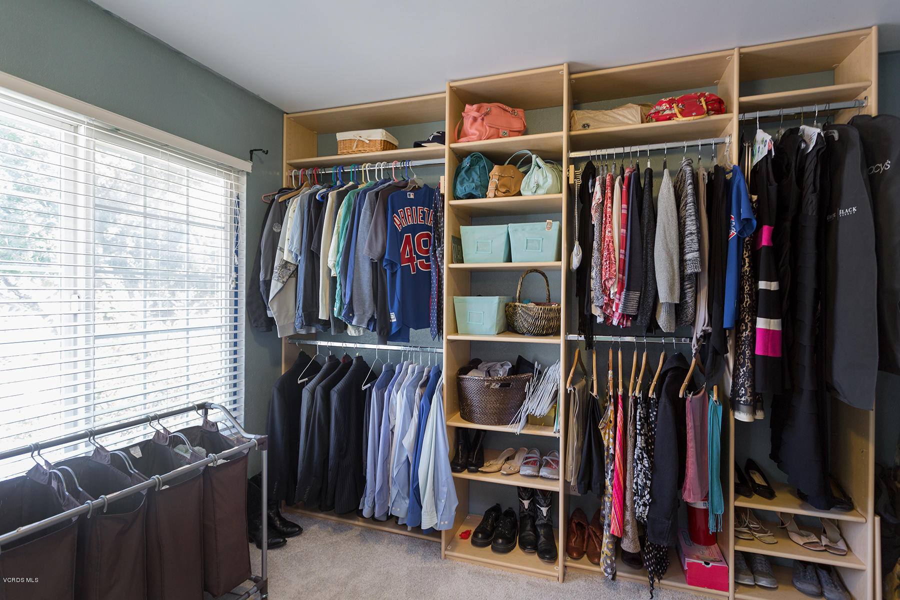 648 Appleton Road Simi Valley, CA 93065 - Photo 34 of 42 a view of walk in closet with clothes and shoes