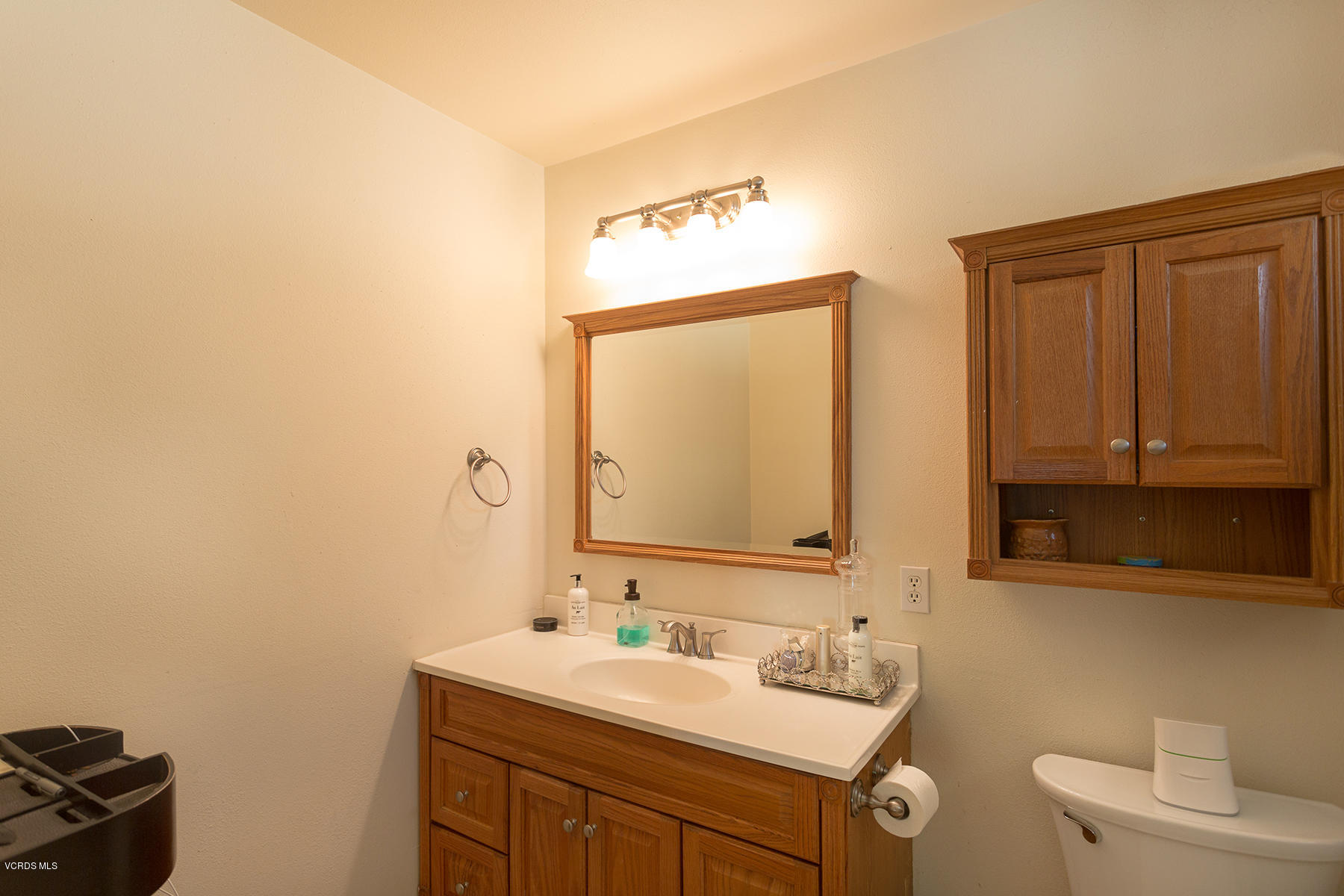 648 Appleton Road Simi Valley, CA 93065 - Photo 35 of 42 a bathroom with a toilet sink and mirror