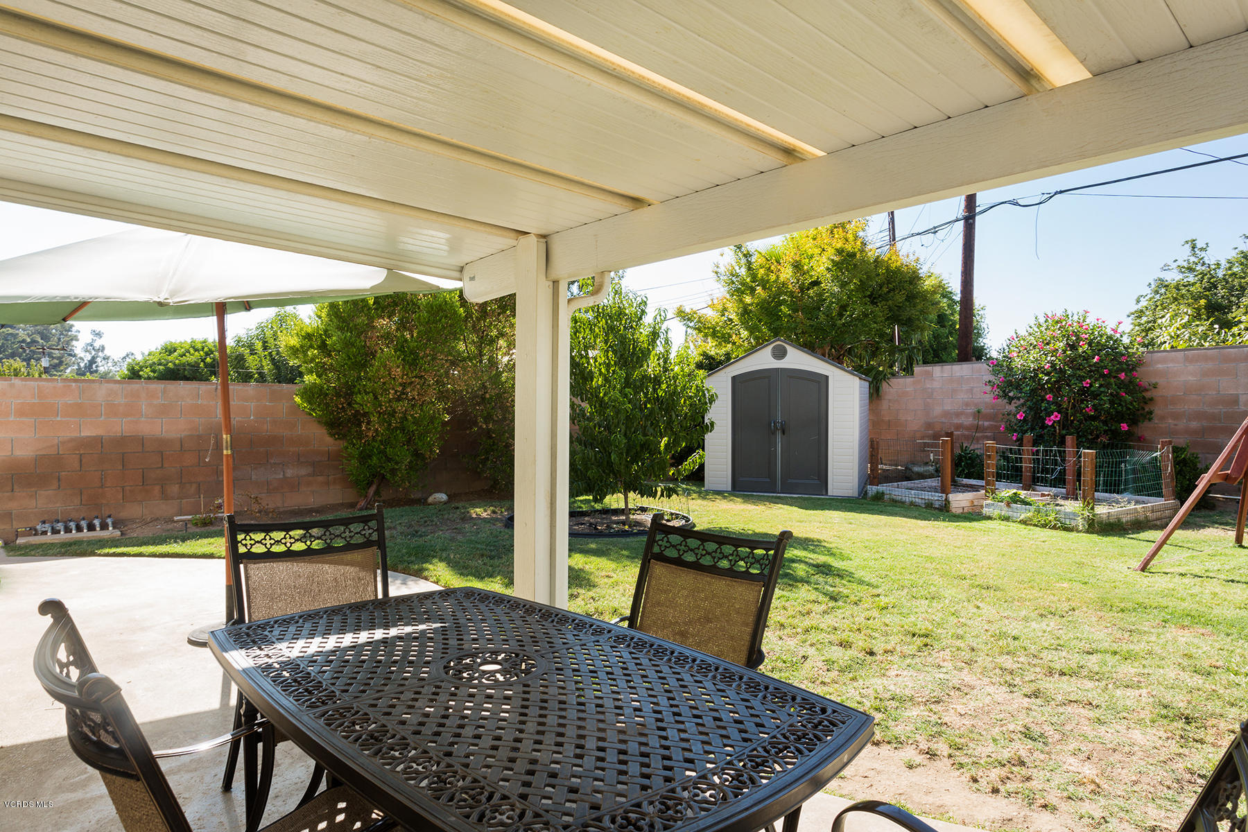 648 Appleton Road Simi Valley, CA 93065 - Photo 37 of 42 a view of a patio with a table chairs and a backyard