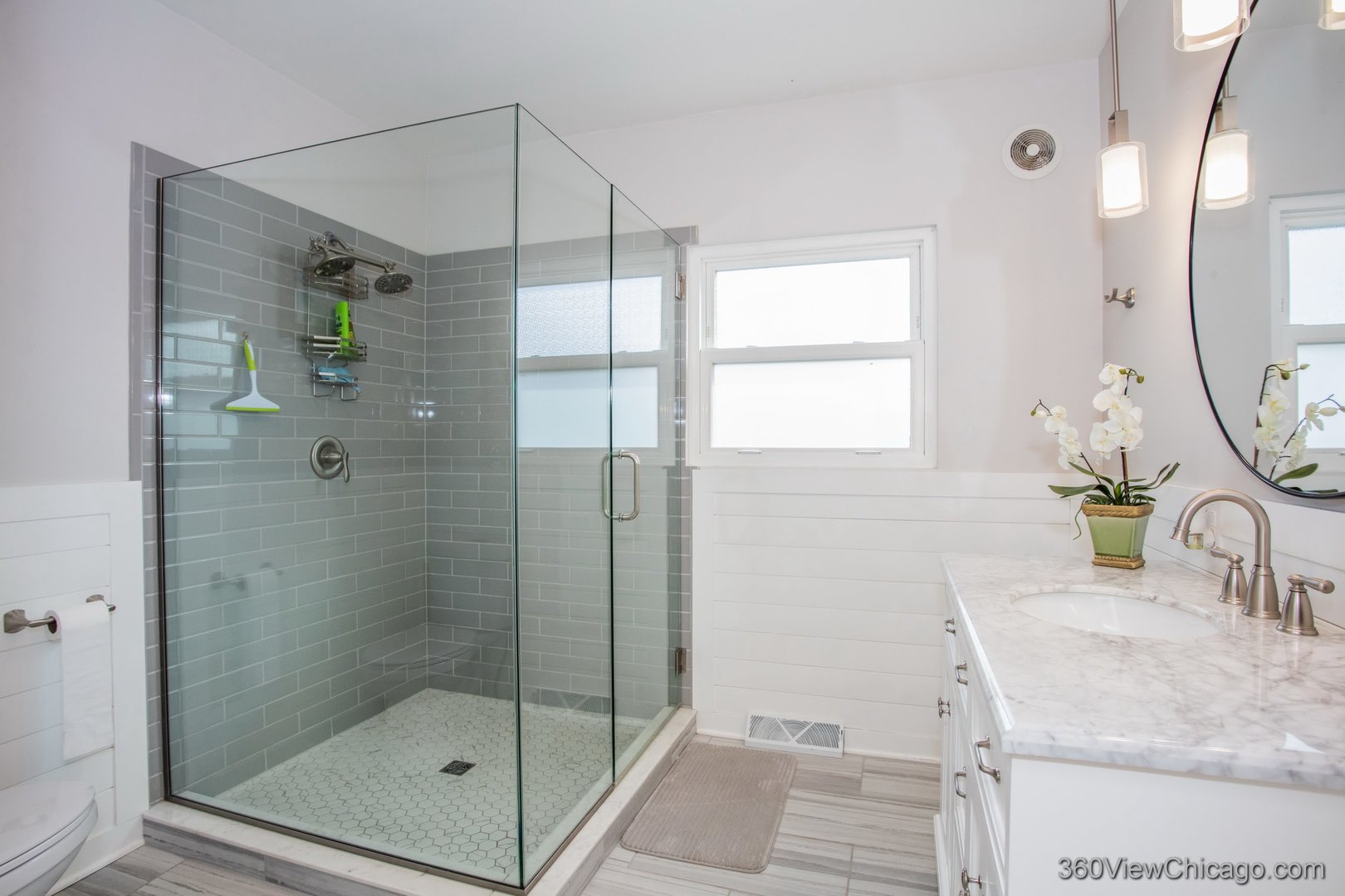 6308 Main Street Union, IL 60180 - Photo 18 of 39 a bathroom with a granite countertop sink a mirror and shower