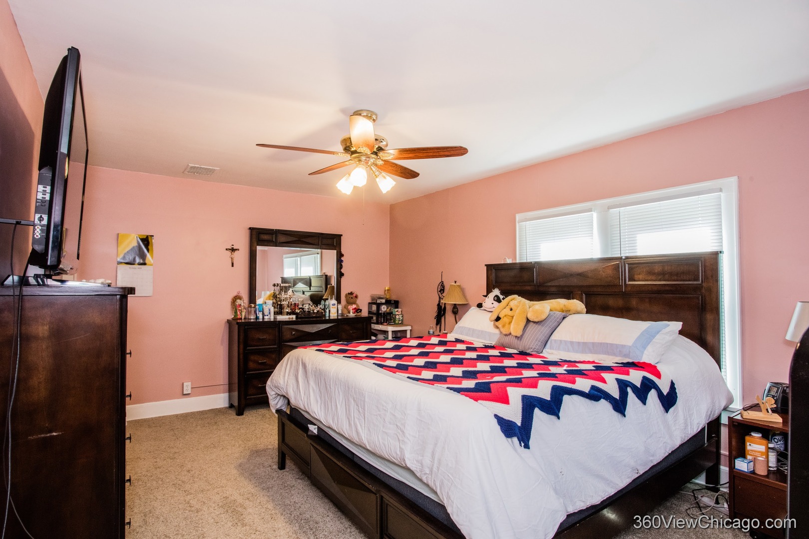 6308 Main Street Union, IL 60180 - Photo 23 of 39 a bedroom with a bed and a flat tv screen on dresser