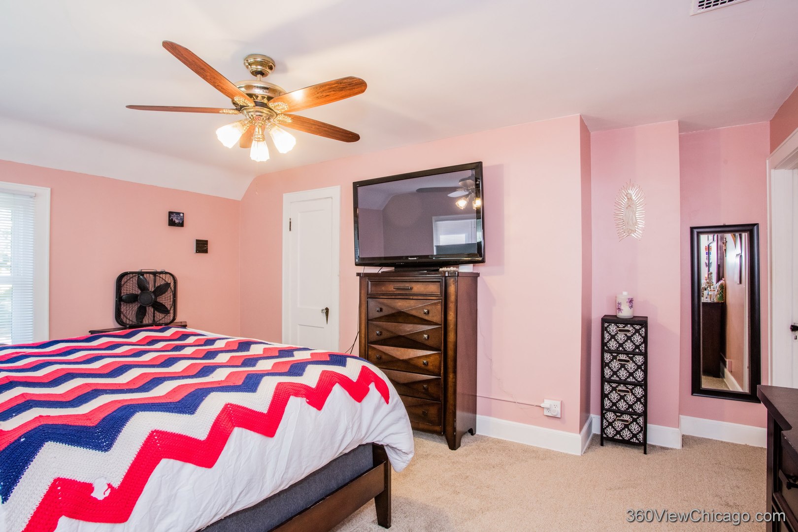 6308 Main Street Union, IL 60180 - Photo 24 of 39 a bedroom with a bed and a flat tv screen on dresser