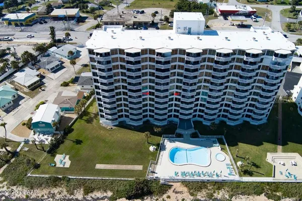 an aerial view of residential houses with outdoor space