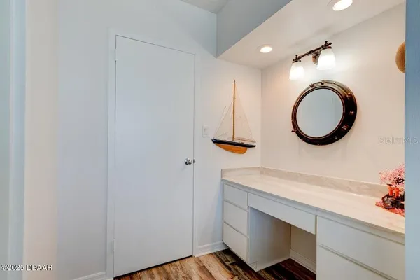 a bedroom with a large bed and a dresser