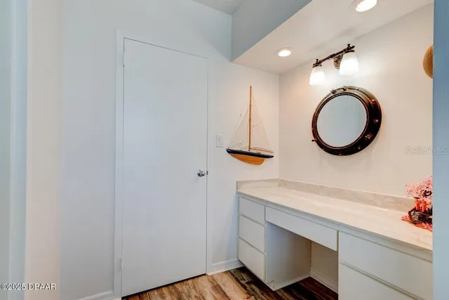 a bedroom with a large bed and a dresser