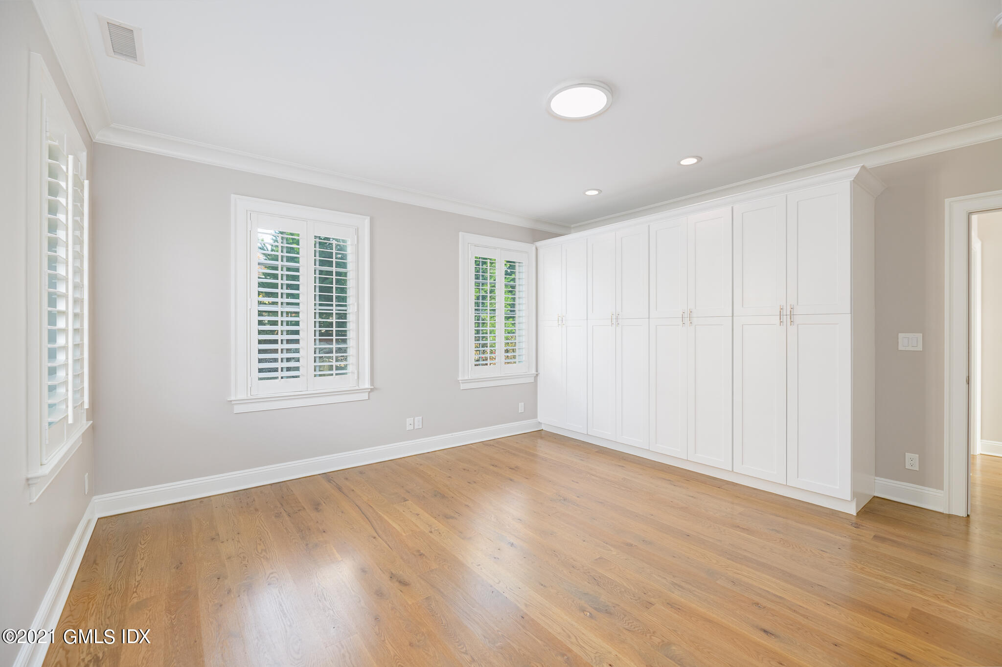 550 River Road Cos Cob, CT 06807 - Photo 20 of 33 a view of an empty room with wooden floor and a window
