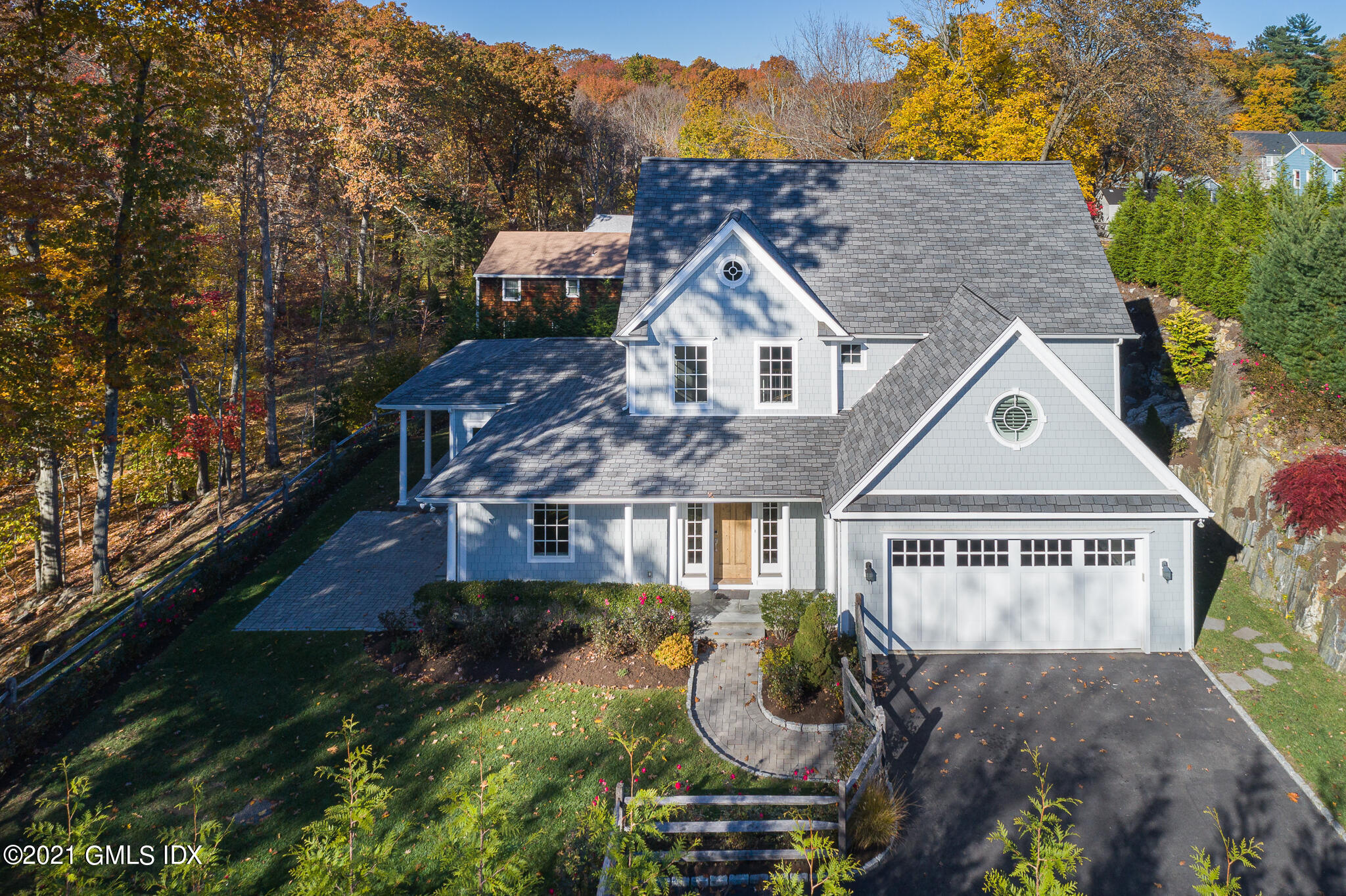 550 River Road Cos Cob, CT 06807 - Photo 29 of 33 a front view of a house with garden