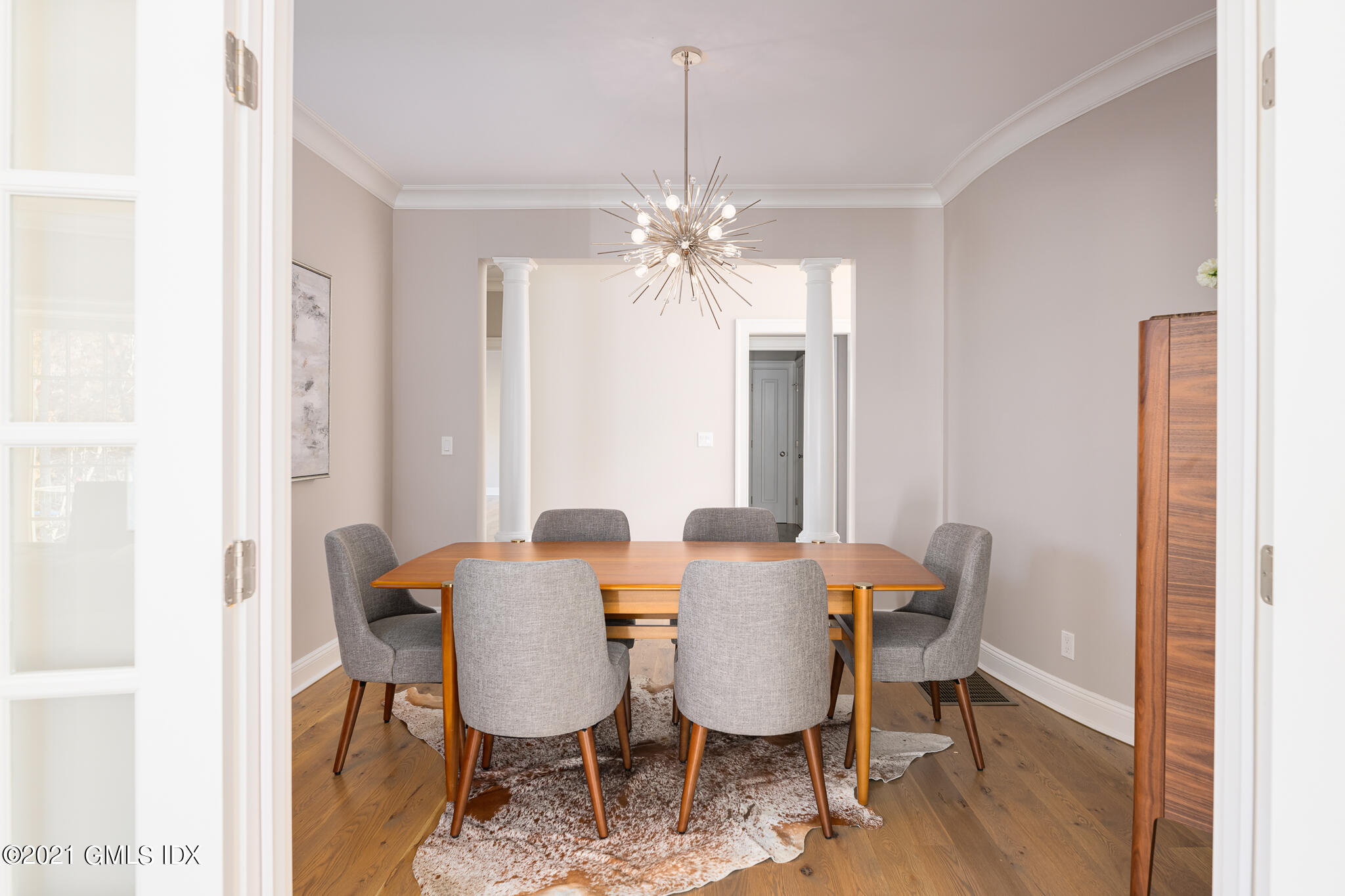 550 River Road Cos Cob, CT 06807 - Photo 7 of 33 a view of a dining room with furniture and chandelier