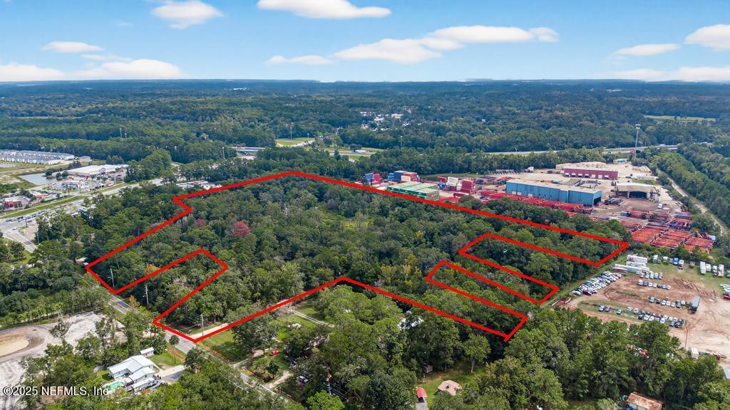 9032 New Kings Road Jacksonville, FL 32219 - Photo 12 of 23 an aerial view of a houses with a lush green hillside