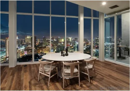 a view of a dining room with furniture and window