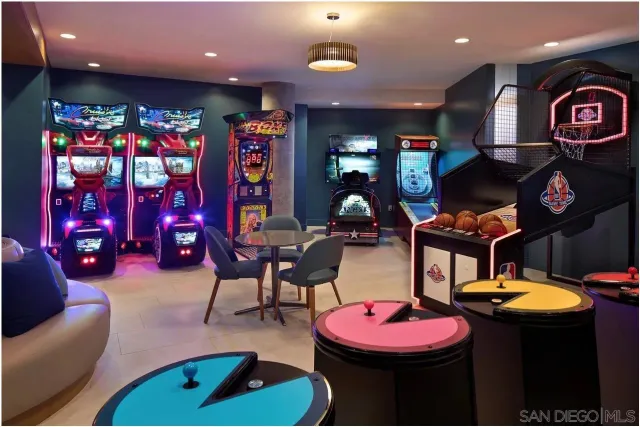 a living room with furniture and kitchen view
