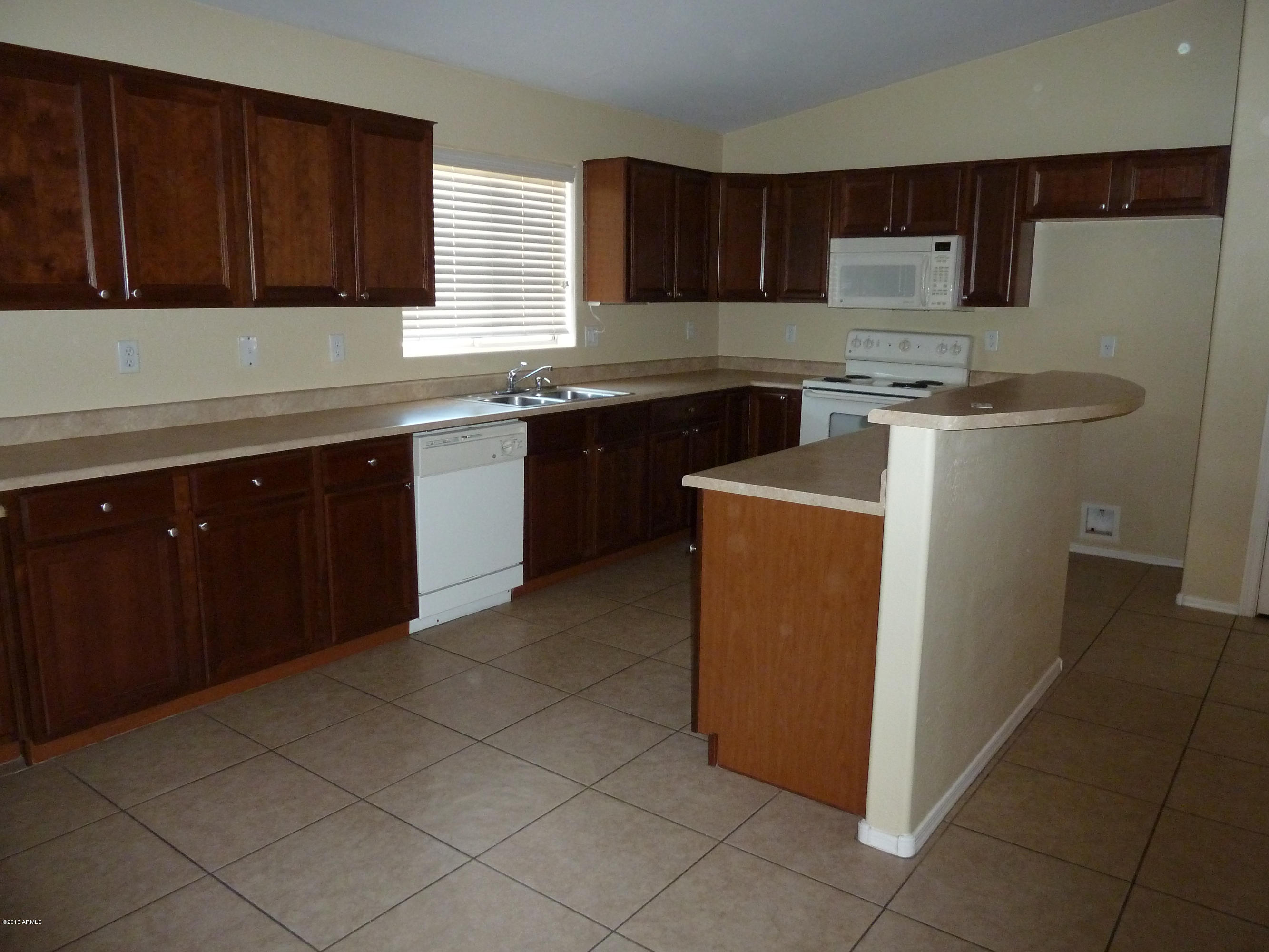 9938 West Heber Road Tolleson, AZ 85353 - Photo 4 of 17 Kitchen cabinet space with built-in appl