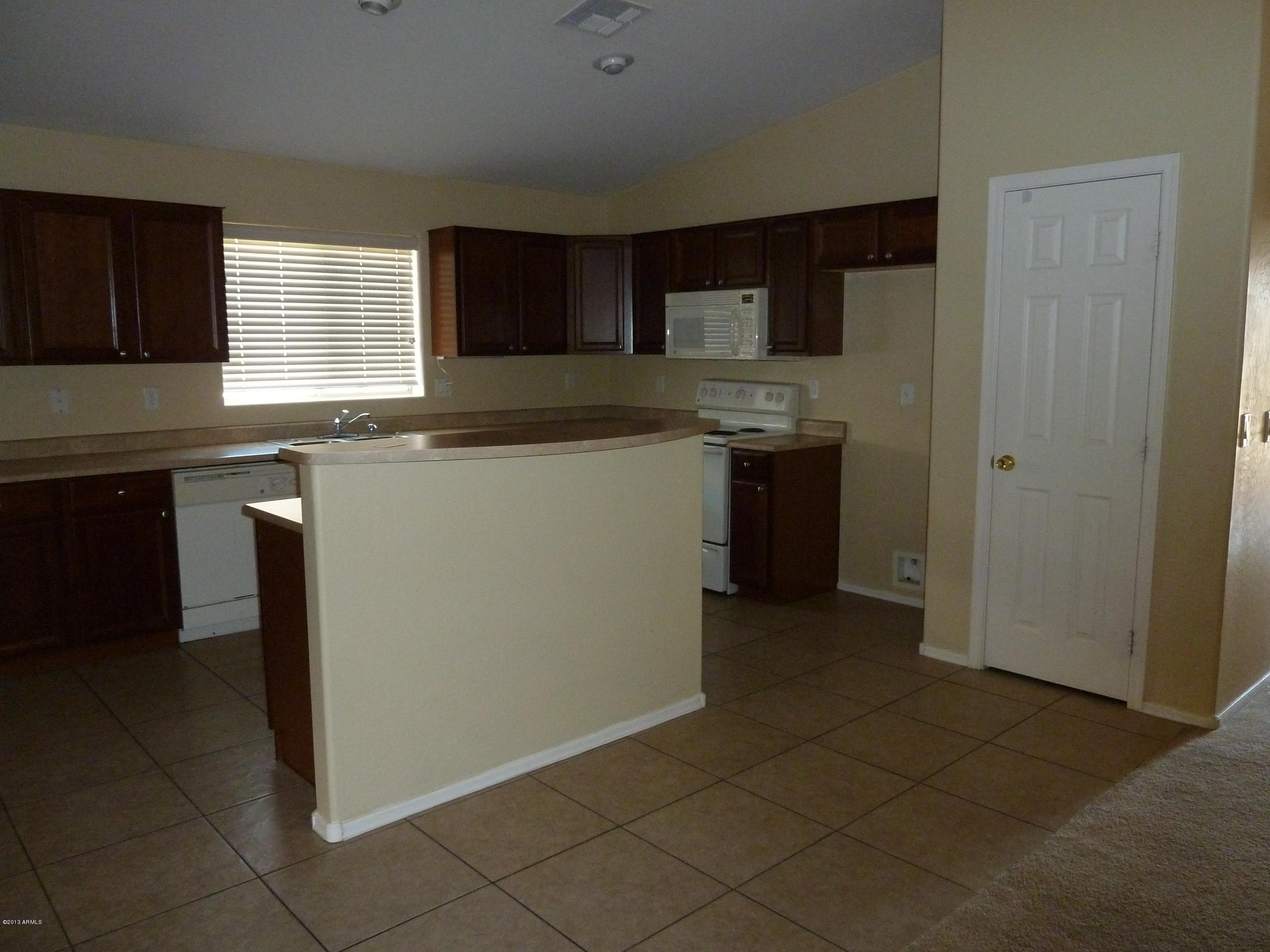 9938 West Heber Road Tolleson, AZ 85353 - Photo 5 of 17 Notice the kitchen panty door
