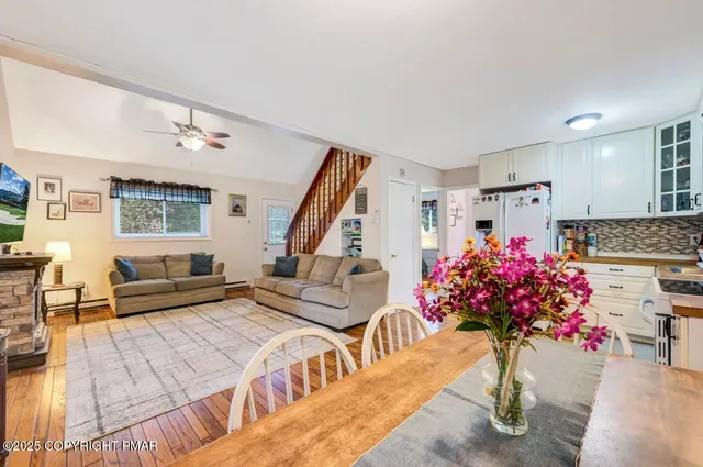 a living room with furniture and flowers
