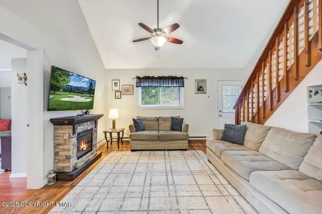 a living room with furniture and a flat screen tv