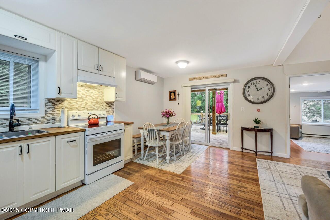 53 Barren Road East Stroudsburg, PA 18302 - Photo 18 of 39 a living room with furniture a clock and a window