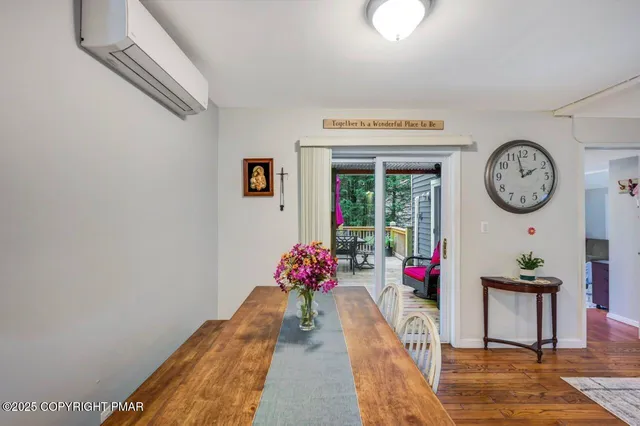 a view of a hallway with flower pots