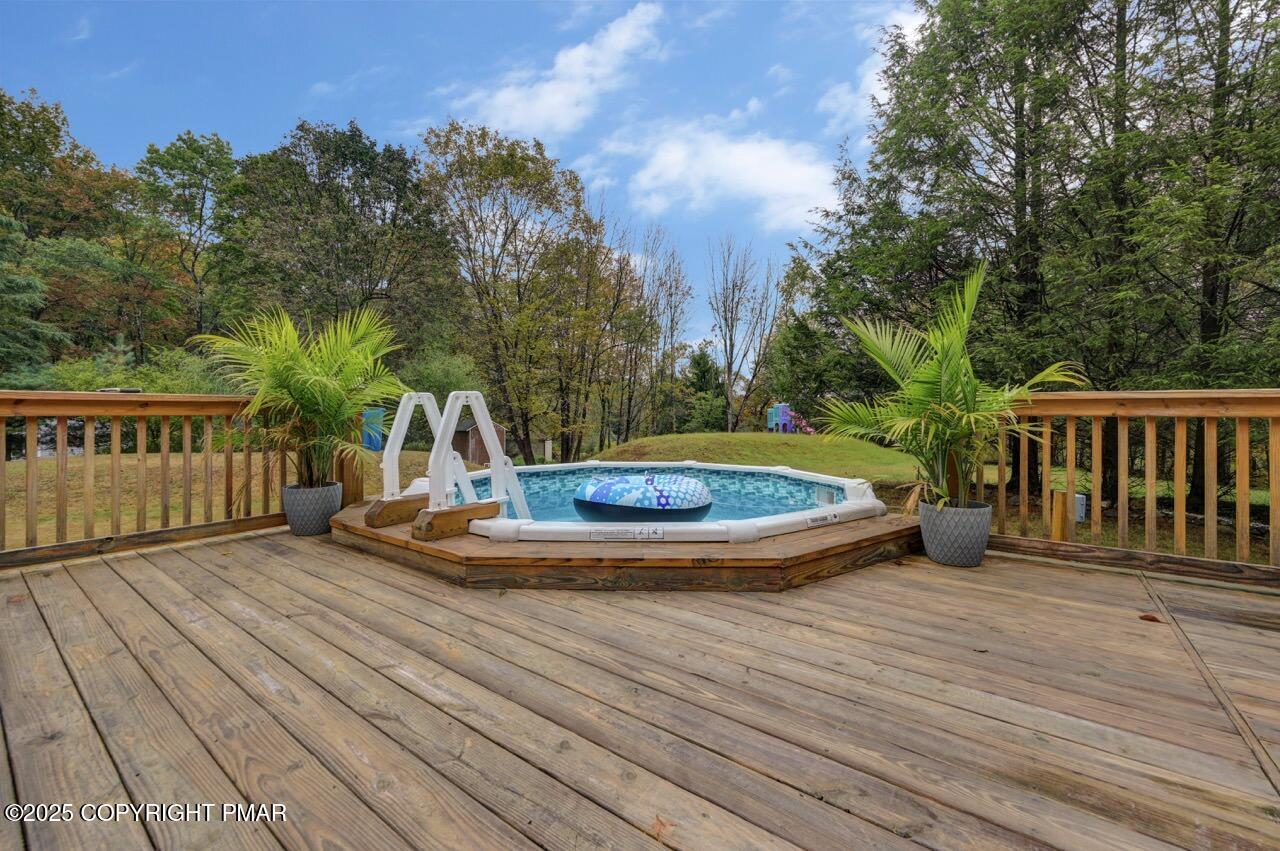53 Barren Road East Stroudsburg, PA 18302 - Photo 22 of 39 a view of a wooden deck and a backyard