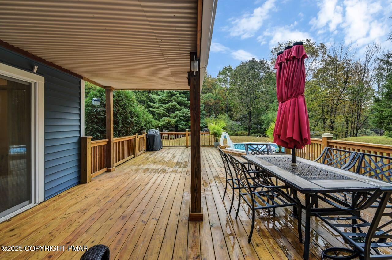 53 Barren Road East Stroudsburg, PA 18302 - Photo 26 of 39 a view of a patio with a table and chairs