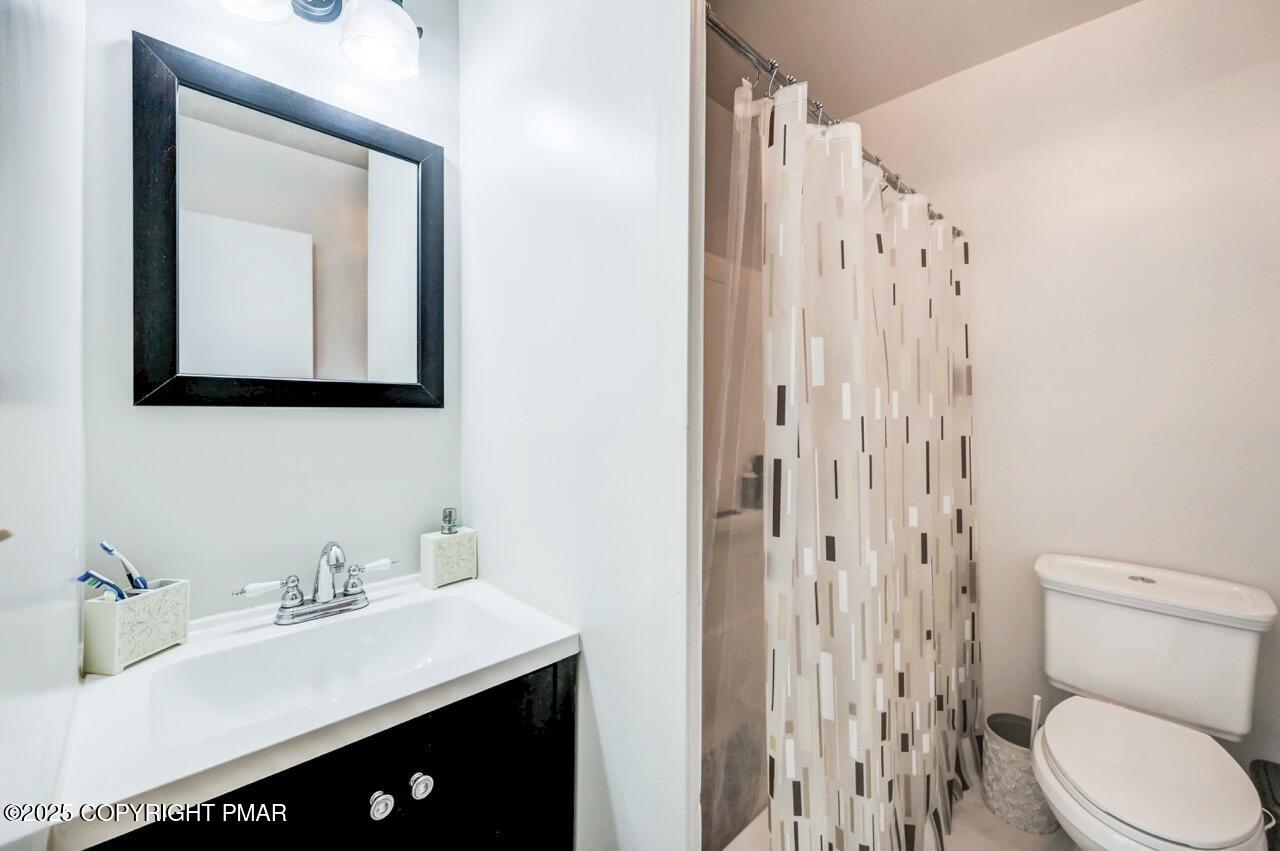 53 Barren Road East Stroudsburg, PA 18302 - Photo 28 of 39 a bathroom with a toilet sink and mirror