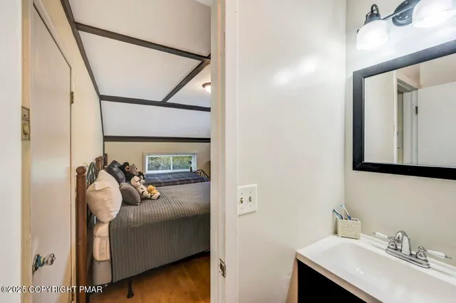 a bathroom with a sink and mirror