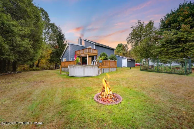 a swimming pool with trees in the background
