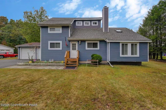 a front view of a house with swimming pool