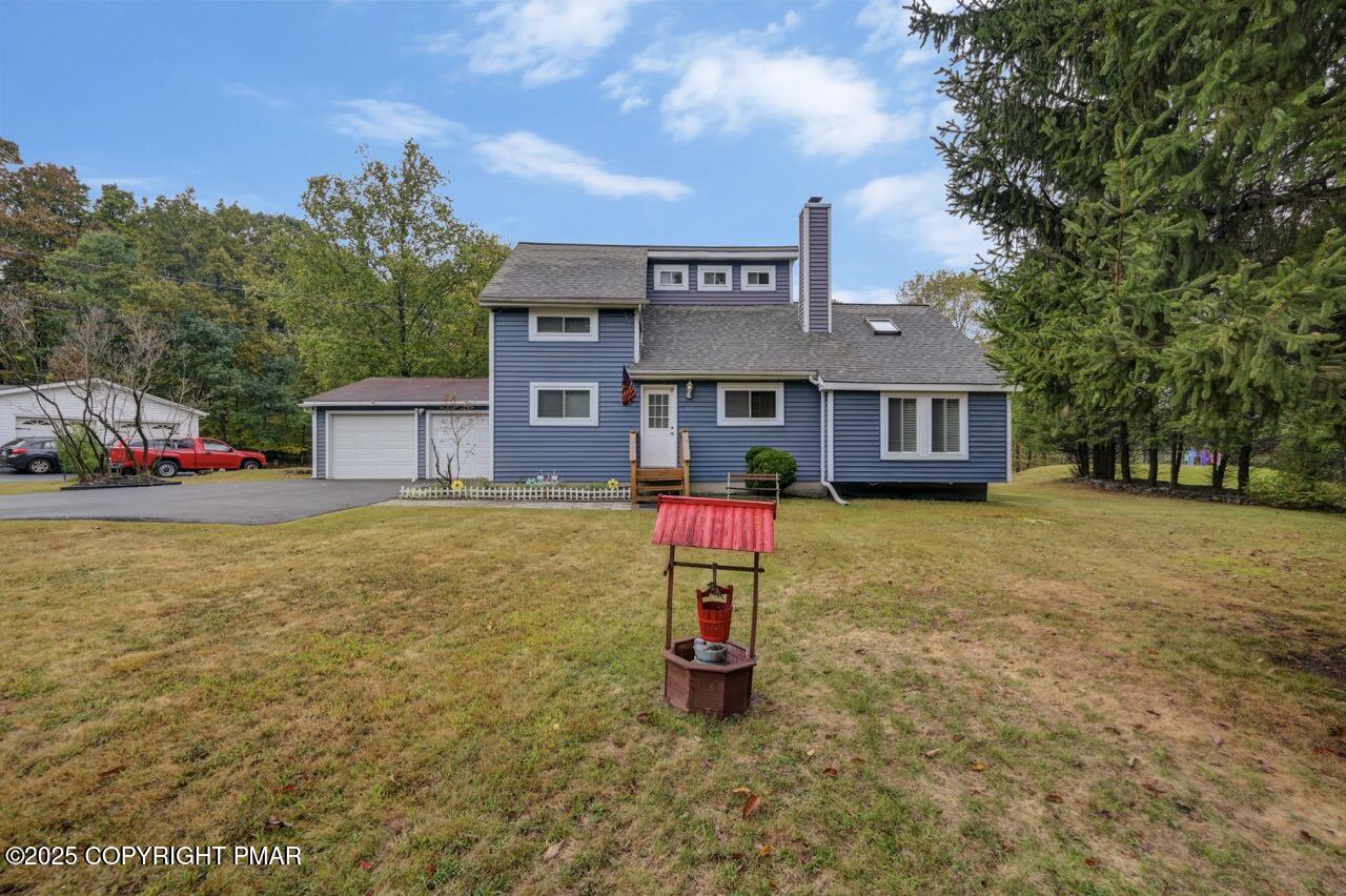 53 Barren Road East Stroudsburg, PA 18302 - Photo 4 of 39 a front view of a house with a yard and garage
