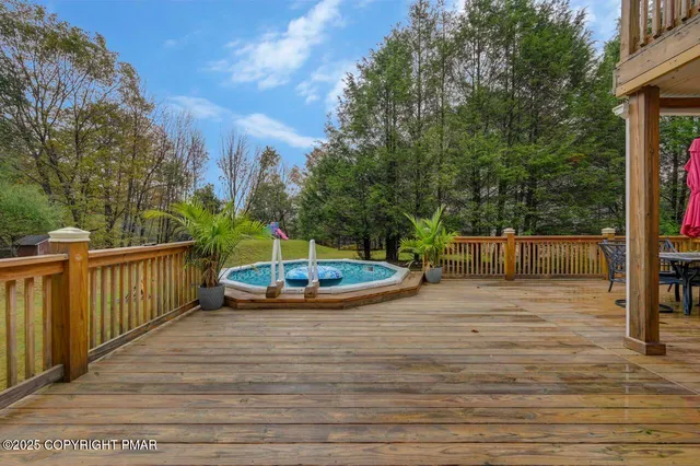 a view of a swimming pool with deck