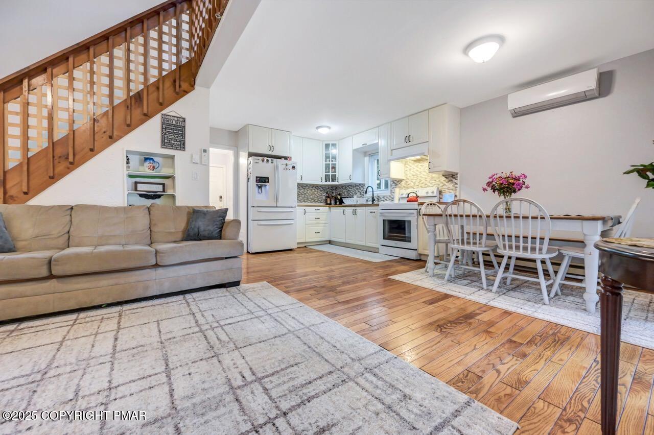 53 Barren Road East Stroudsburg, PA 18302 - Photo 10 of 39 a living room with furniture a dining table and chairs with wooden floor
