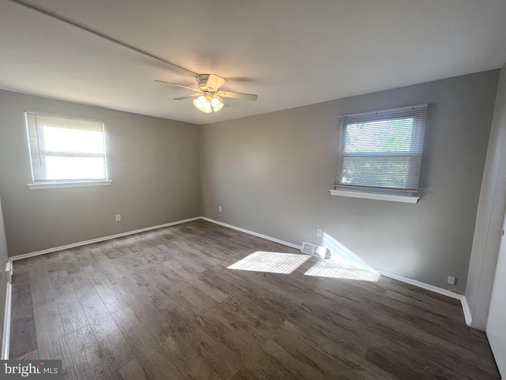 371 Avon Street, Unit 2 Philadelphia, PA 19116 - Photo 12 of 16 a view of empty room with wooden floor and fan