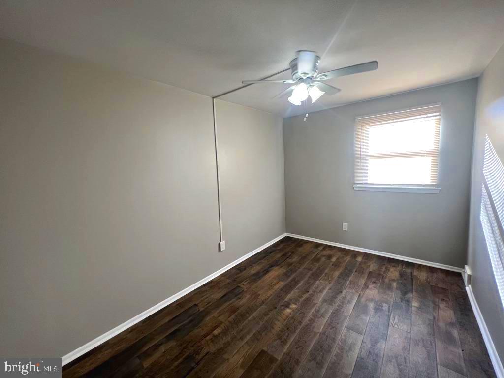 371 Avon Street, Unit 2 Philadelphia, PA 19116 - Photo 14 of 16 an empty room with wooden floor fan and windows