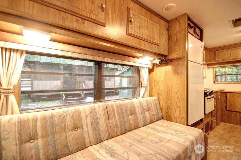 90-2 Wilderness Way Maple Falls, WA 98266 - Photo 13 of 39 a bedroom with a bed and wooden cabinets