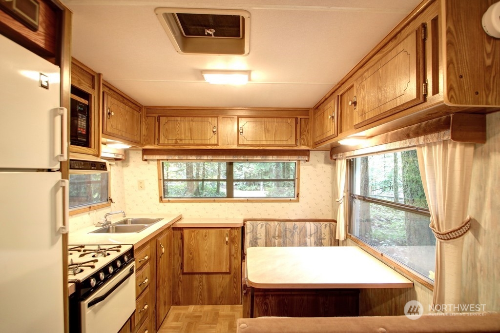 90-2 Wilderness Way Maple Falls, WA 98266 - Photo 14 of 39 a kitchen with a stove a sink and a refrigerator