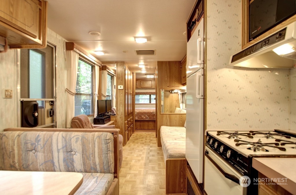 90-2 Wilderness Way Maple Falls, WA 98266 - Photo 18 of 39 a view of a living room with furniture and a fireplace