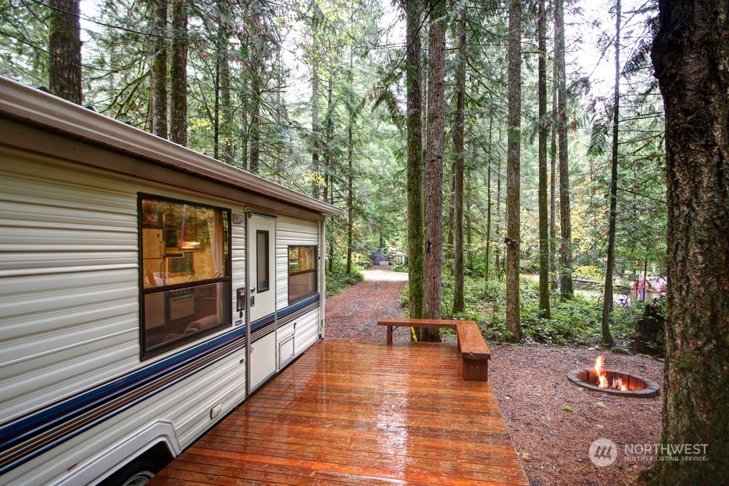 90-2 Wilderness Way Maple Falls, WA 98266 - Photo 19 of 39 a view of a house with backyard and sitting area