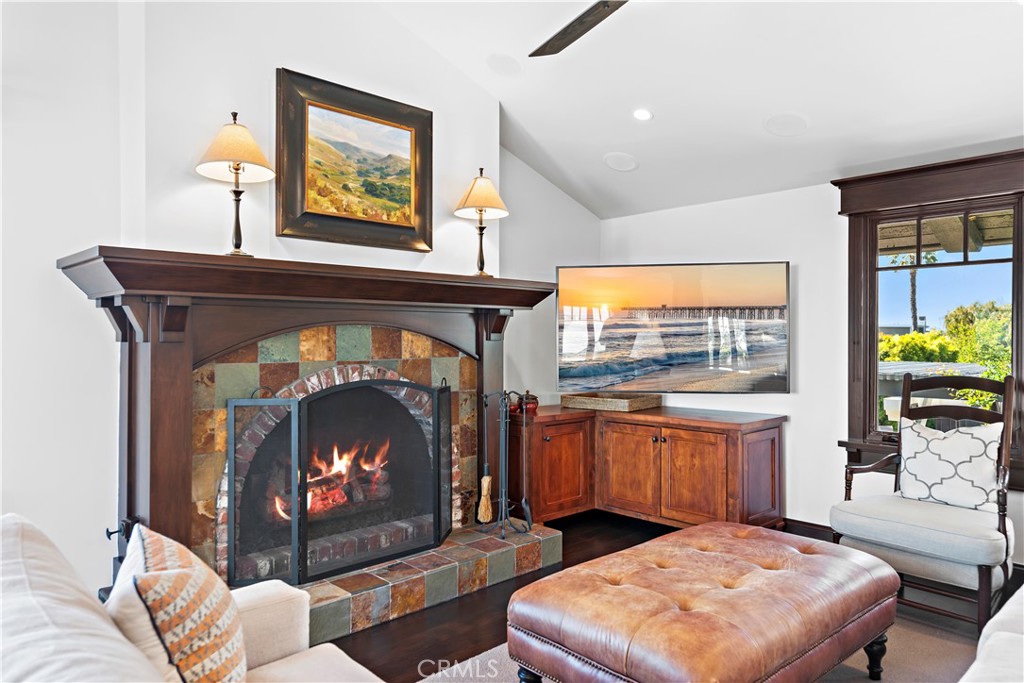 4 Monarch Bay Drive Dana Point, CA 92629 - Photo 14 of 34 a living room with stainless steel appliances furniture a fireplace and a flat screen tv