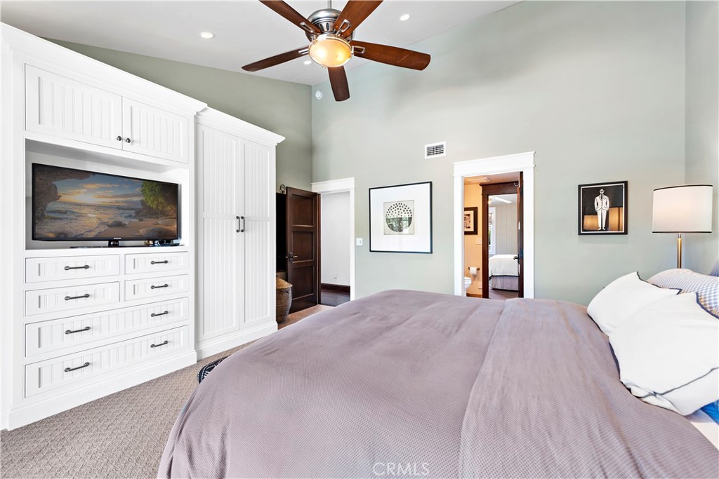 4 Monarch Bay Drive Dana Point, CA 92629 - Photo 20 of 34 a bedroom with a bed and a flat screen tv