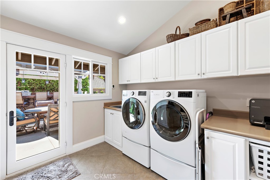 4 Monarch Bay Drive Dana Point, CA 92629 - Photo 27 of 34 a utility room with sink dryer and washer