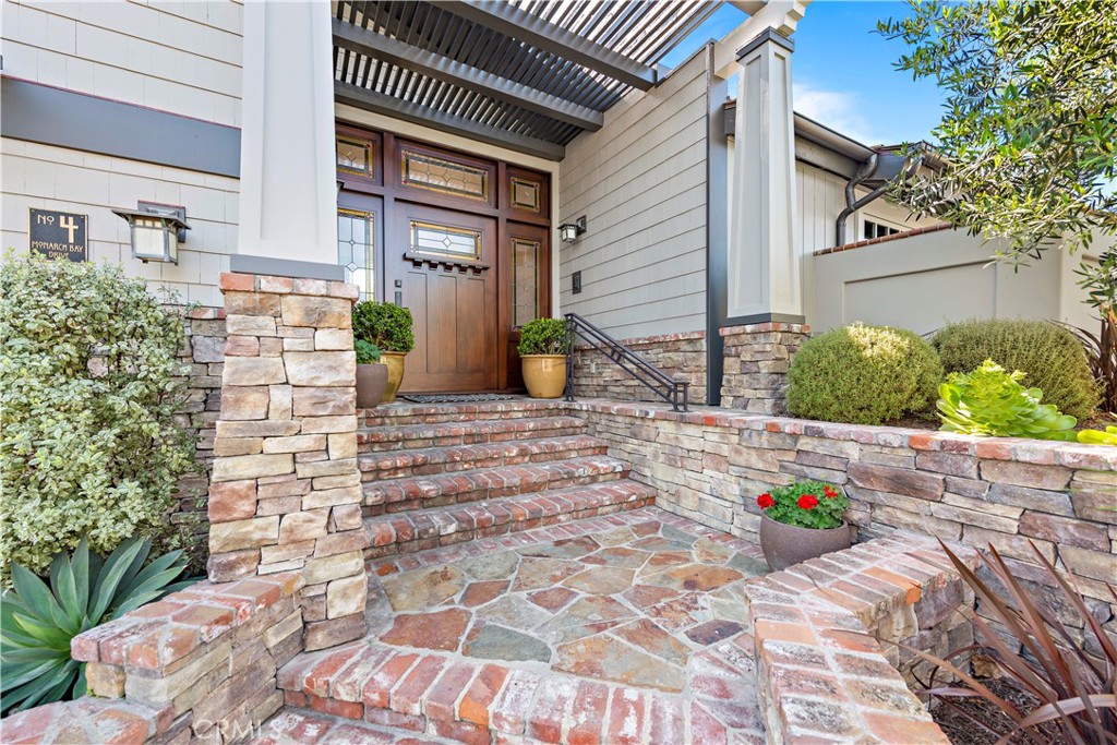 4 Monarch Bay Drive Dana Point, CA 92629 - Photo 3 of 34 a view of a house with potted plants