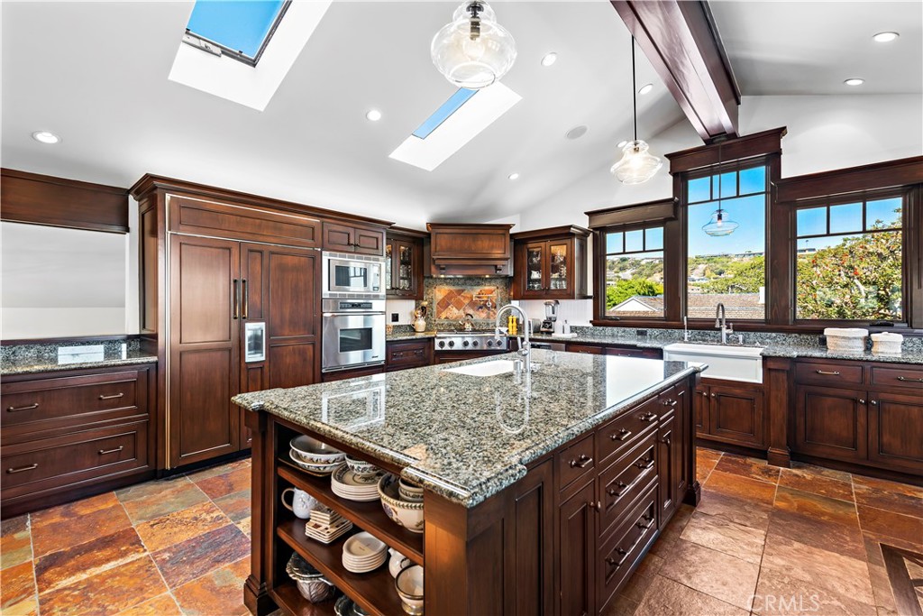 4 Monarch Bay Drive Dana Point, CA 92629 - Photo 5 of 34 a kitchen with stainless steel appliances granite countertop sink stove and refrigerator