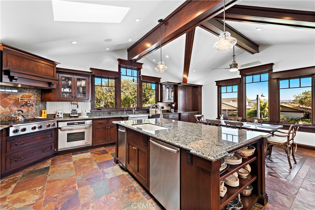 4 Monarch Bay Drive Dana Point, CA 92629 - Photo 6 of 34 a kitchen with stainless steel appliances granite countertop a stove and a sink