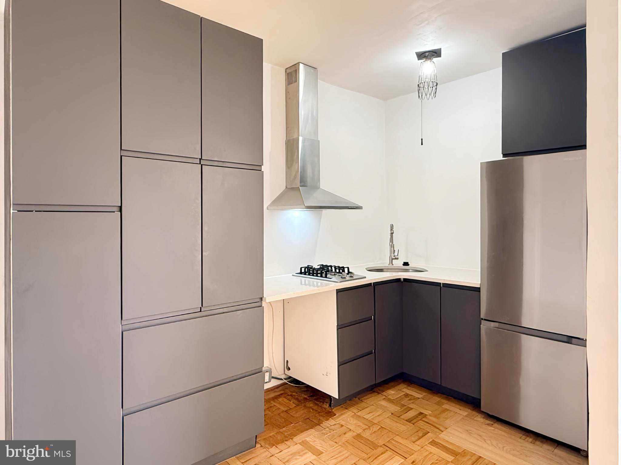 2500 Q Street Northwest, Unit 529 Washington, DC 20007 - Photo 5 of 29 Sleek modern kitchen with stylish finishes.