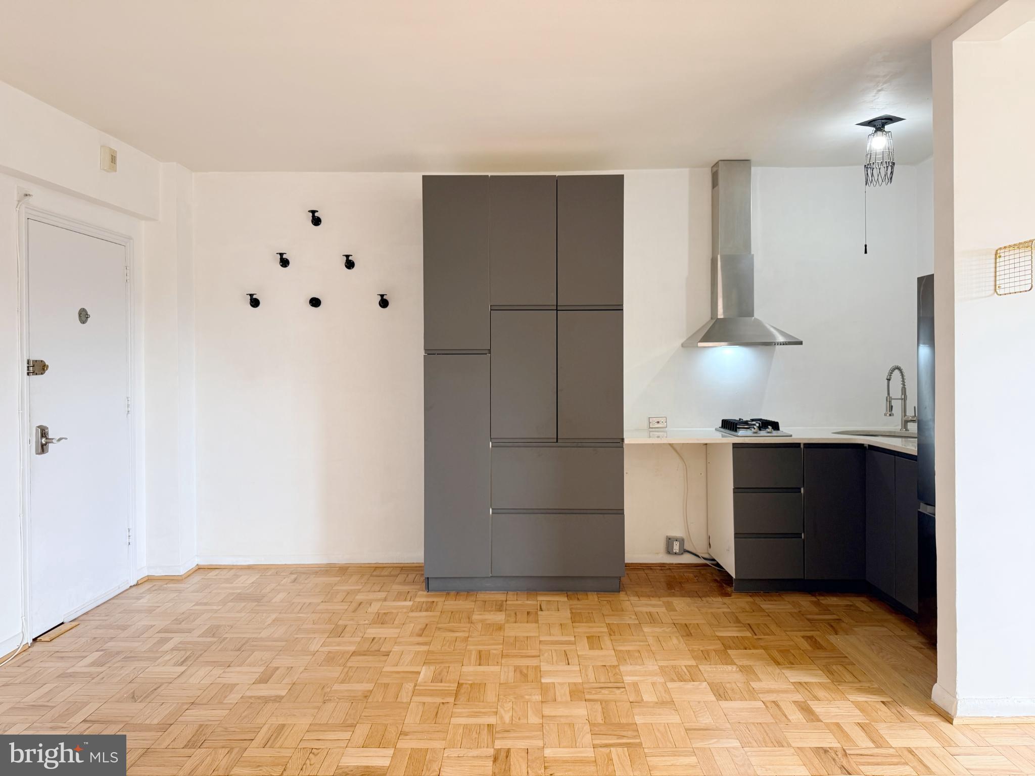 2500 Q Street Northwest, Unit 529 Washington, DC 20007 - Photo 8 of 29 Modern kitchen with sleek cabinetry.